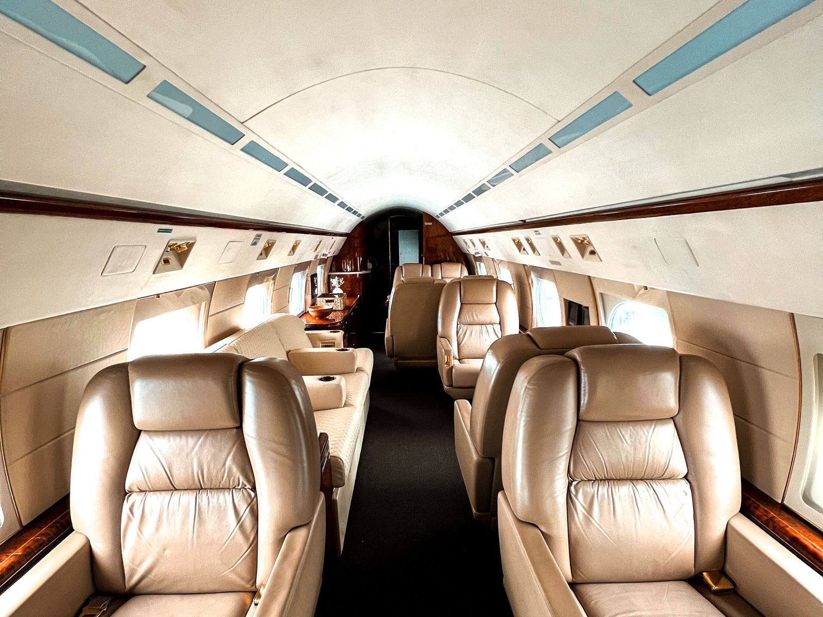 A business jet cabin with leather seating.