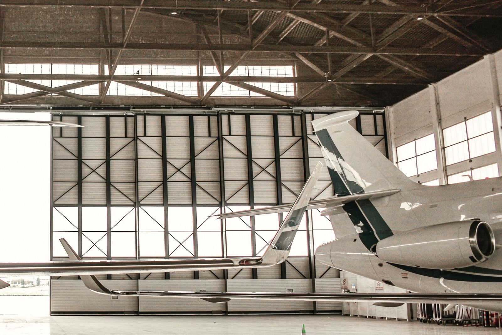 A business jet in a hangar.